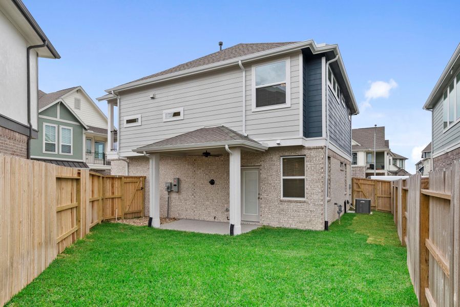 Exterior details and patio area of a home in Balmoral, Humble (Image 18).