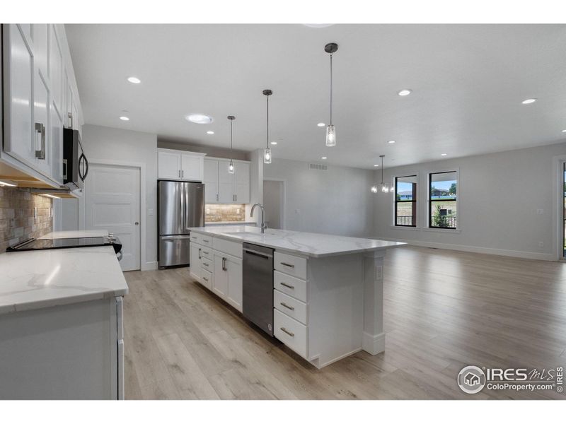 Quartz (granite is available) countertops in the kitchen and all baths