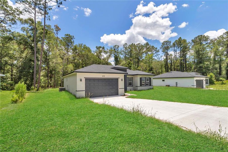 Front exterior of a new home in , Dunnellon, FL, highlighting curb appeal (Image 19). Front exterior of a new home in , Dunnellon, FL, highlighting curb appeal (Image 19).