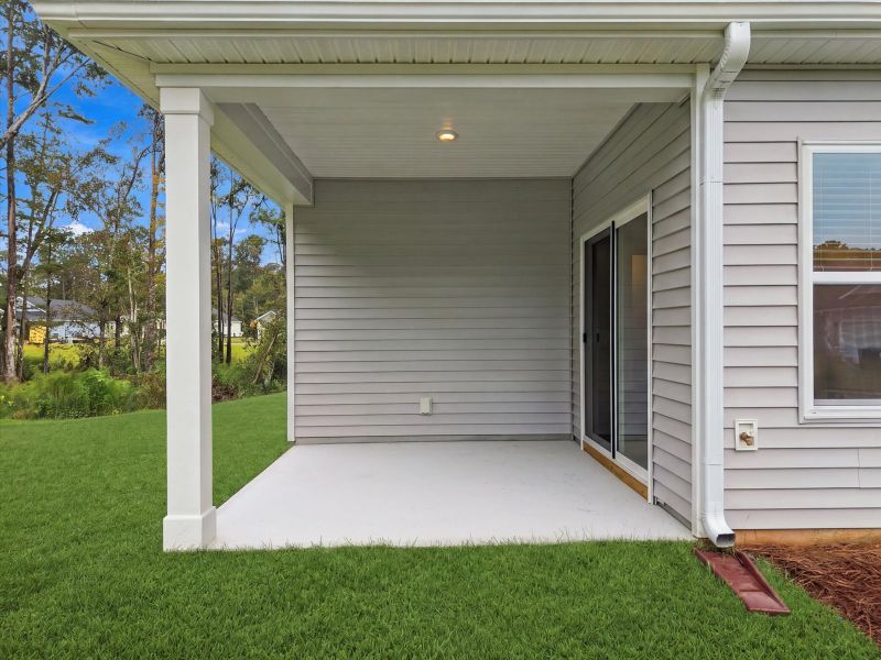 Exterior details and patio area of a home in Palmetto Place, Longs (Image 3).