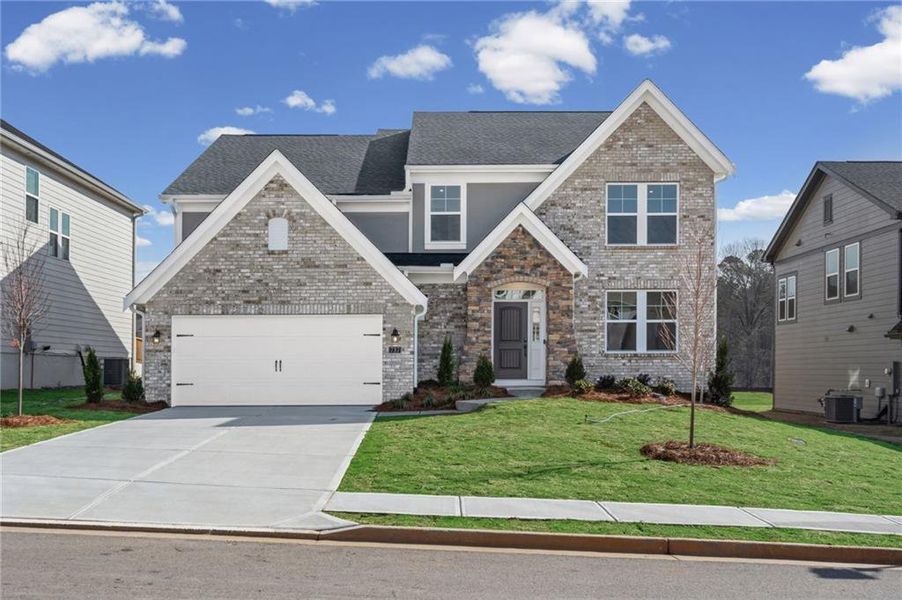 Front exterior of a new home in Twin Lakes, Hoschton, GA, highlighting curb appeal (Image 1). Front exterior of a new home in Twin Lakes, Hoschton, GA, highlighting curb appeal (Image 1).