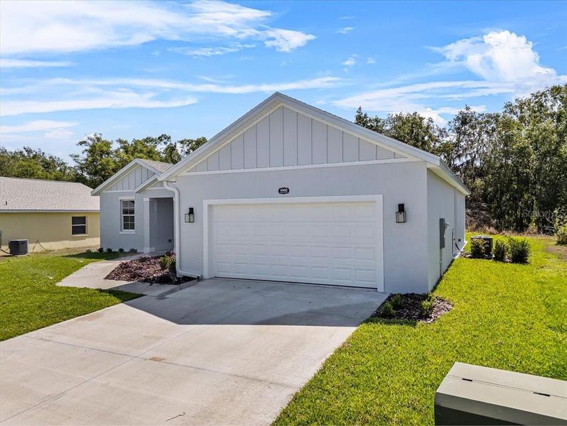 Front exterior of a new home in , Mulberry, FL, highlighting curb appeal (Image 2). Front exterior of a new home in , Mulberry, FL, highlighting curb appeal (Image 2).