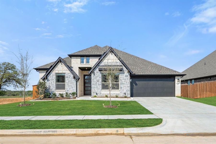 Front exterior of a new home in Mockingbird Hills, Joshua, TX, highlighting curb appeal (Image 20).