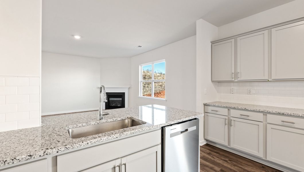 Representative furnished interior of a home built from the WILMINGTON by D.R. Horton in Benjamin's Grove, Woodruff (Image 10).