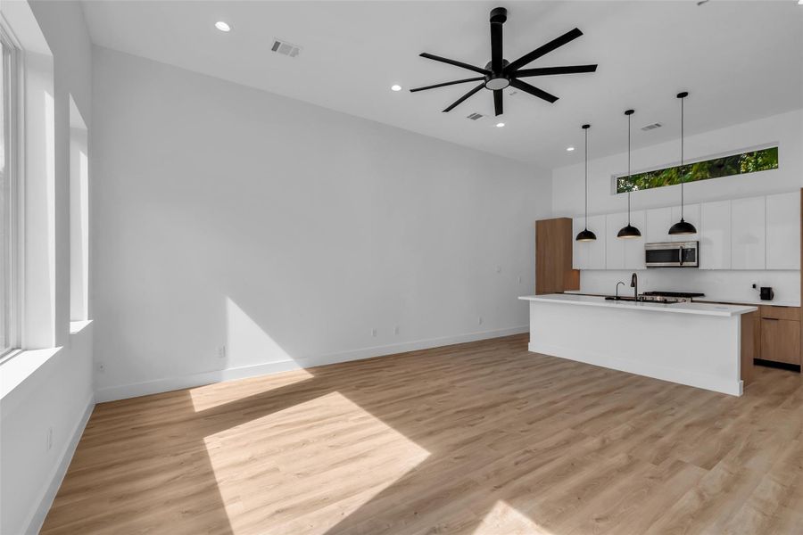 Directly in front of the kitchen is the living area, creating a seamless flow between cooking, dining, and relaxation spaces. Directly in front of the kitchen is the living area, creating a seamless flow between cooking, dining, and relaxation spaces.