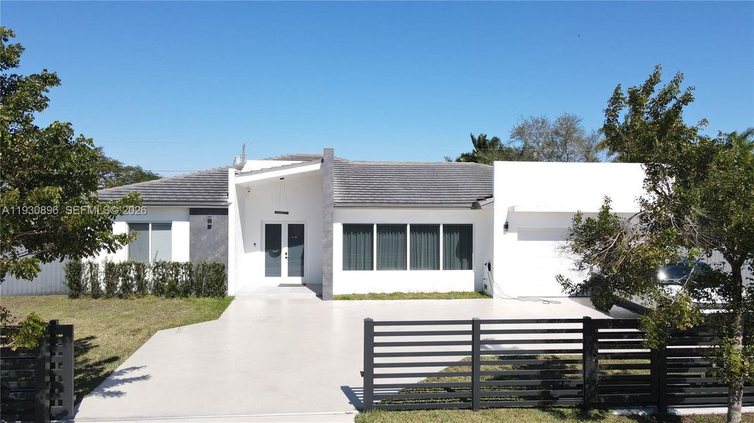 Front exterior of a new home in , Homestead, FL, highlighting curb appeal (Image 19). Front exterior of a new home in , Homestead, FL, highlighting curb appeal (Image 19).