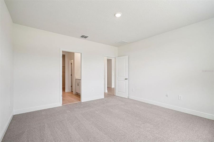 Spacious, unfurnished interior of a new home in The Reserve at Hammock Oaks - Signature Series, Lady Lake (Image 21).