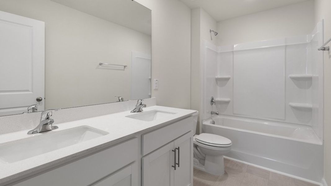 Furnished interior view inside a new home in The Grove at Matthews Landing, Fuquay Varina (Image 8).