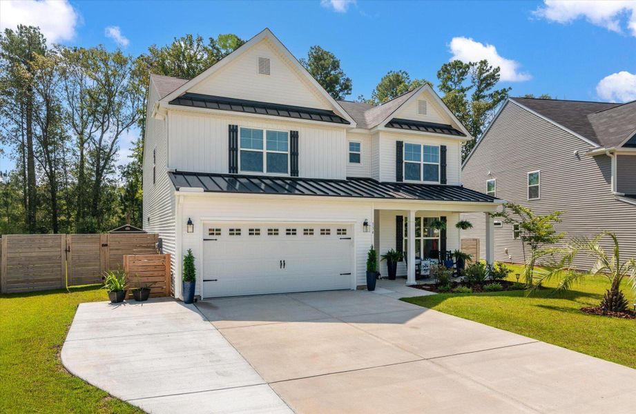 Front exterior of a new home in Parker's Preserve, Ridgeville, SC, highlighting curb appeal (Image 20).