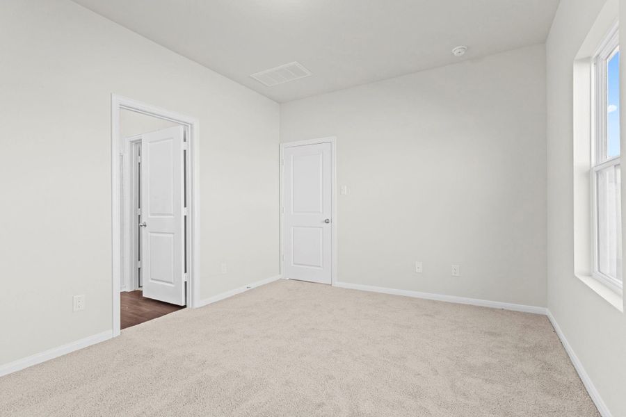 Another view of the primary suite highlighting its spacious design and natural light. This private retreat offers comfort, style, and easy access to the luxurious ensuite bath. Stop paying your landlord for their investment and start investing in you! Another view of the primary suite highlighting its spacious design and natural light. This private retreat offers comfort, style, and easy access to the luxurious ensuite bath. Stop paying your landlord for their investment and start investing in you!