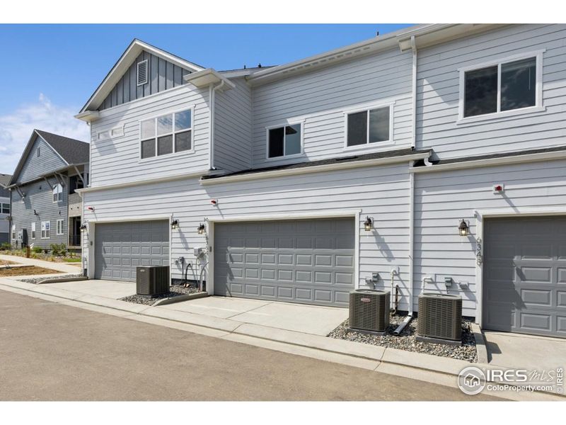Front exterior of a new home in Kinston Mainstreet Townhomes, Loveland, CO, highlighting curb appeal (Image 30). Front exterior of a new home in Kinston Mainstreet Townhomes, Loveland, CO, highlighting curb appeal (Image 30).