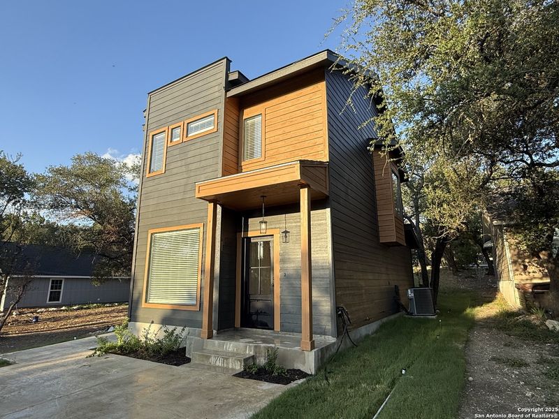 Front exterior of a new home in , Canyon Lake, TX, highlighting curb appeal (Image 16).