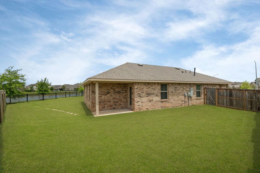 Exterior details and patio area of a home in Sunterra, Katy (Image 20).