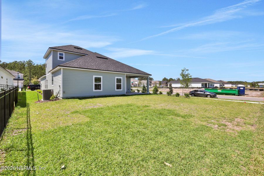 Exterior details and patio area of a home in Hyland Trail, Green Cove Springs (Image 4).