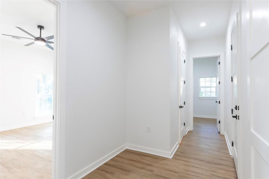 Hallway providing access to the walk-in pantry and master bedroom.