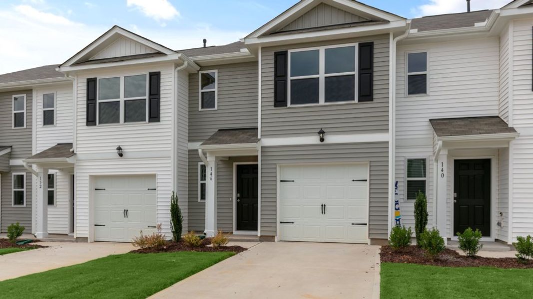 Front exterior of a new home in The Townes at Hunter Hill, Rocky Mount, NC, highlighting curb appeal (Image 23).