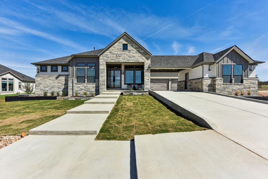 Front exterior of a new home in Feathergrass, Florence, TX, highlighting curb appeal (Image 27).