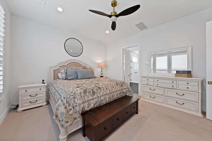 Carpeted room featuring a ceiling fan with brass accents, recessed lighting, and white walls Carpeted room featuring a ceiling fan with brass accents, recessed lighting, and white walls