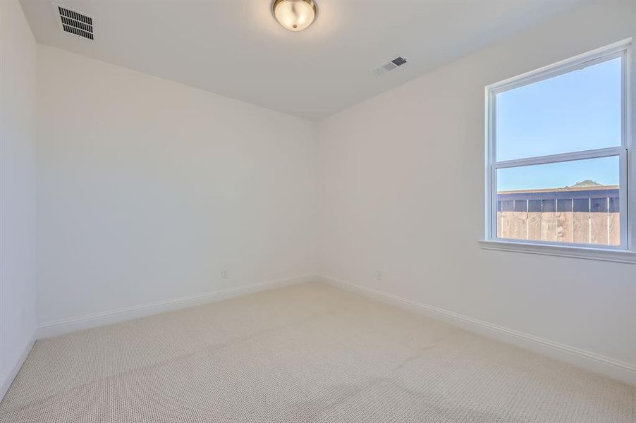 Unfurnished room featuring carpet flooring