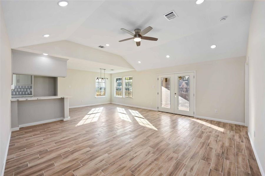 Open-concept living area with tile flooring throughout, offering a bright and inviting space for everyday living.
