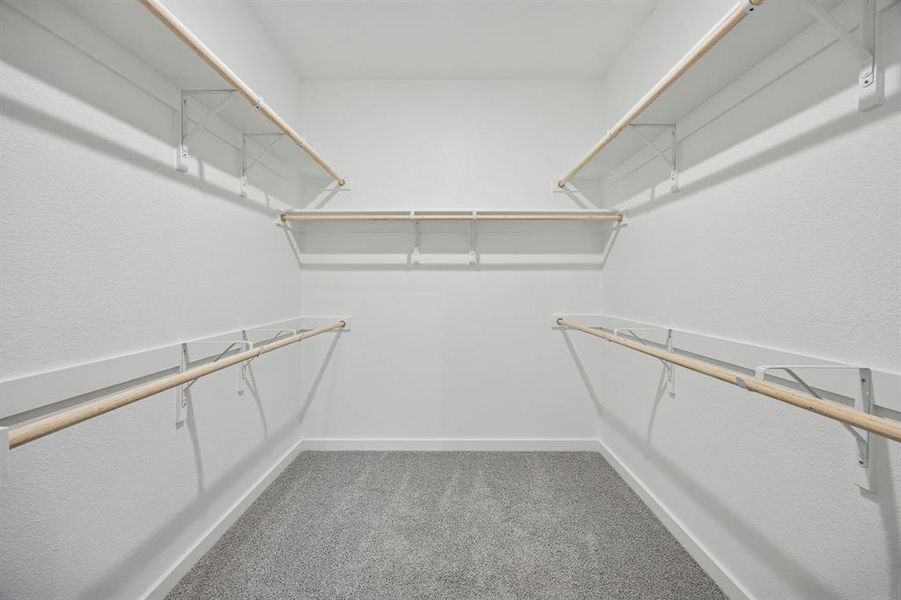 Primary Closet in the Masters home plan by Trophy Signature Homes – REPRESENTATIVE PHOTO