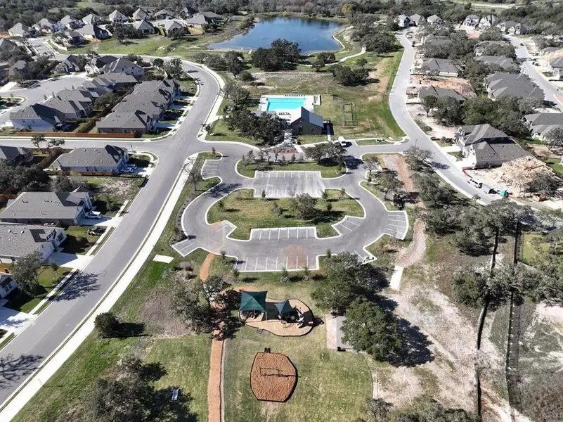 View of property location with a large body of water and nearby suburban area