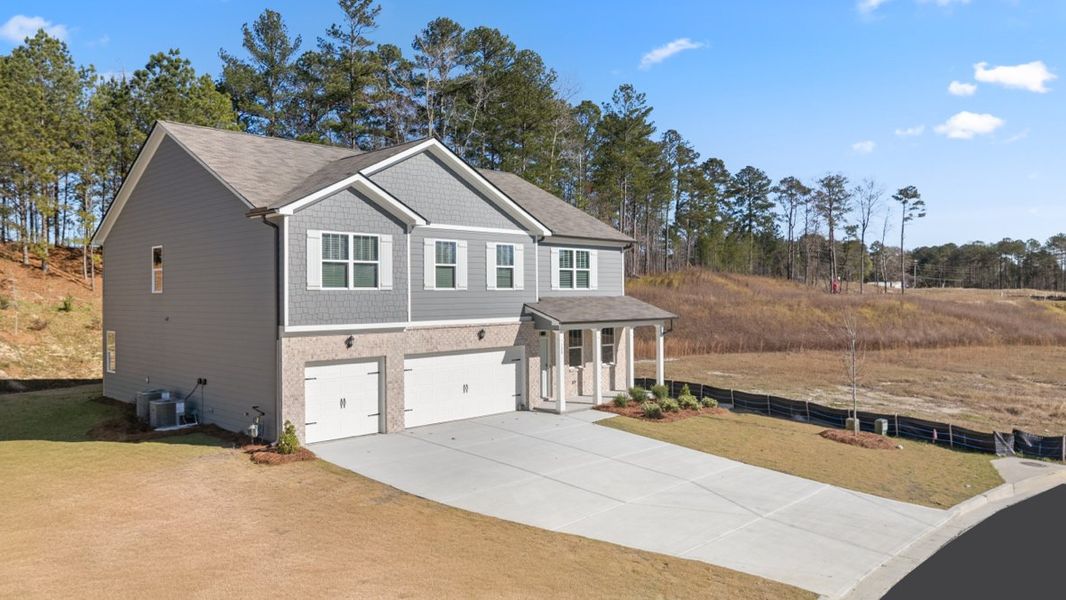 Representative exterior photo of a completed home built from the Mansfield by D.R. Horton in Northwoods at Mirror Lake, Villa Rica, GA (Image 24). Representative exterior photo of a completed home built from the Mansfield by D.R. Horton in Northwoods at Mirror Lake, Villa Rica, GA (Image 24).