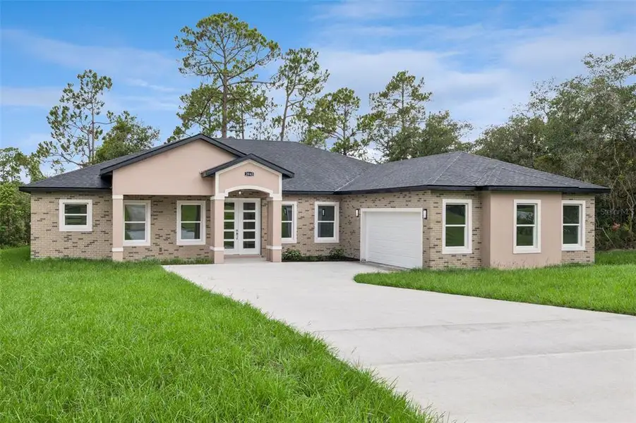 Front exterior of a new home in , Deltona, FL, highlighting curb appeal (Image 1). Front exterior of a new home in , Deltona, FL, highlighting curb appeal (Image 1).