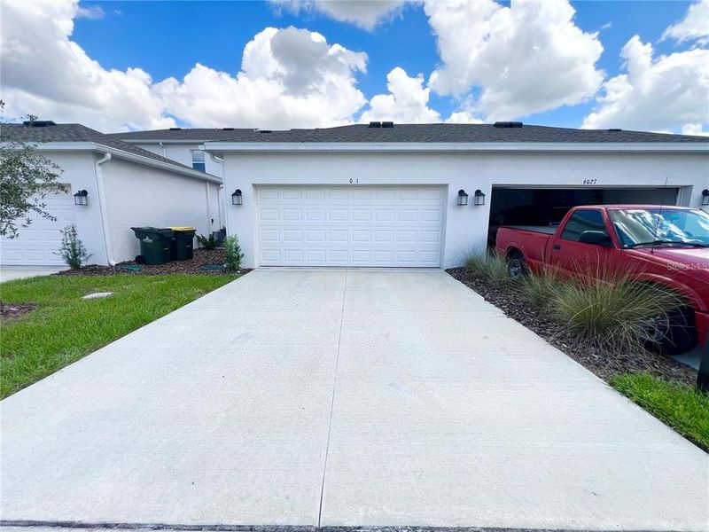 Front exterior of a new home in , Clermont, FL, highlighting curb appeal (Image 29).