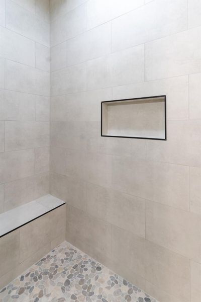 Full bathroom with a tile shower