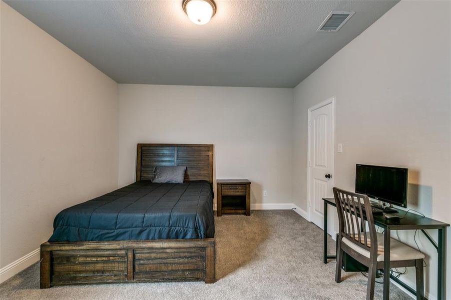 Upstairs Bedroom with carpet floors