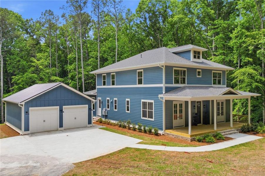 Front exterior of a new home in , Holly Springs, GA, highlighting curb appeal (Image 2). Front exterior of a new home in , Holly Springs, GA, highlighting curb appeal (Image 2).