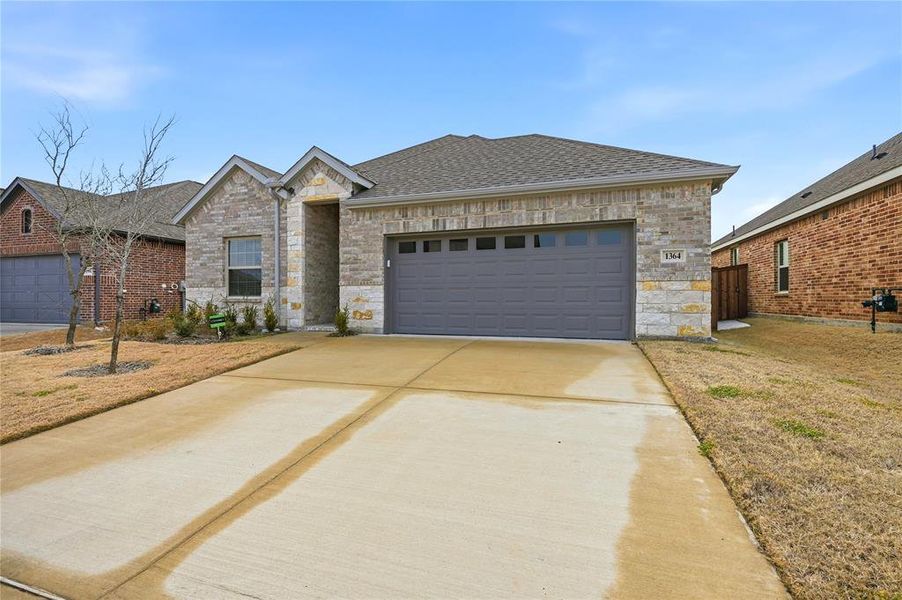 Front exterior of a new home in , Forney, TX, highlighting curb appeal (Image 18). Front exterior of a new home in , Forney, TX, highlighting curb appeal (Image 18).