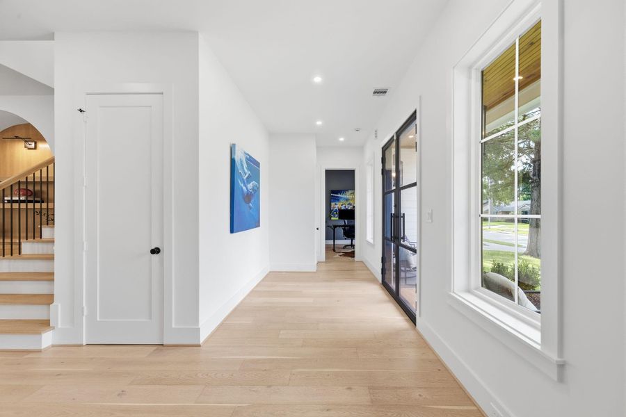 View from the front hallway upon entering the home through the Stunning Double glass doors. View from the front hallway upon entering the home through the Stunning Double glass doors.