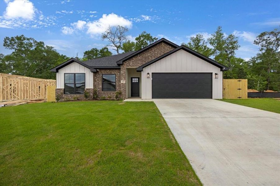 Front exterior of a new home in , Lindale, TX, highlighting curb appeal (Image 2). Front exterior of a new home in , Lindale, TX, highlighting curb appeal (Image 2).