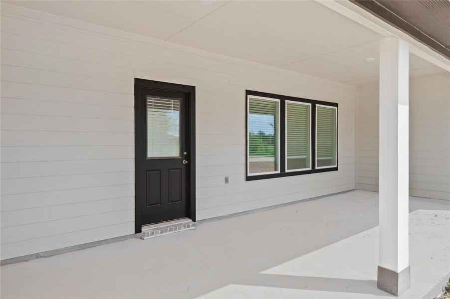 Exterior details and patio area of a home in Blue Heron Estates, Beasley (Image 22).