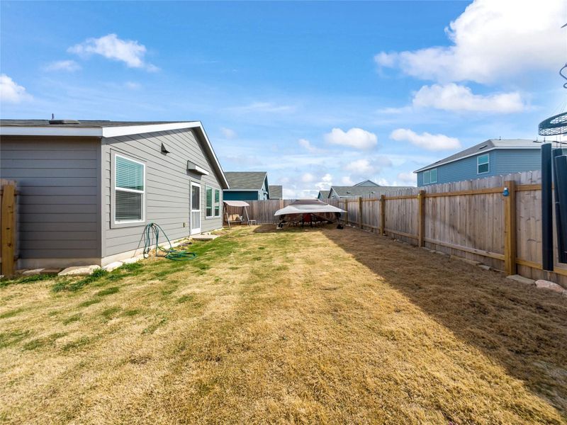 View of fenced backyard