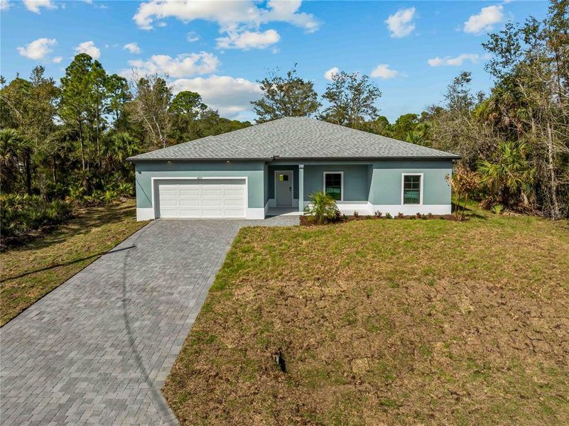 Front exterior of a new home in , North Port, FL, highlighting curb appeal (Image 25).