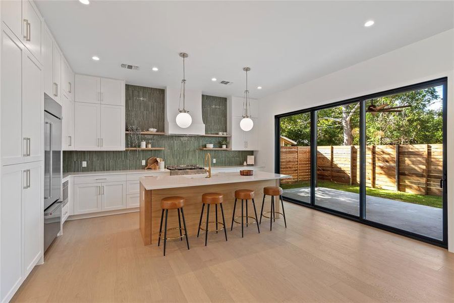 Large sliding glass door leads to outdoor covered patio