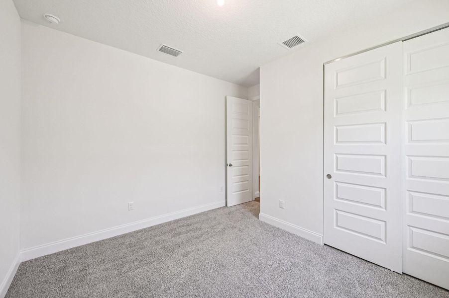 Spacious, unfurnished interior of a new home in Hampton Park - Signature Series, Vero Beach (Image 25).