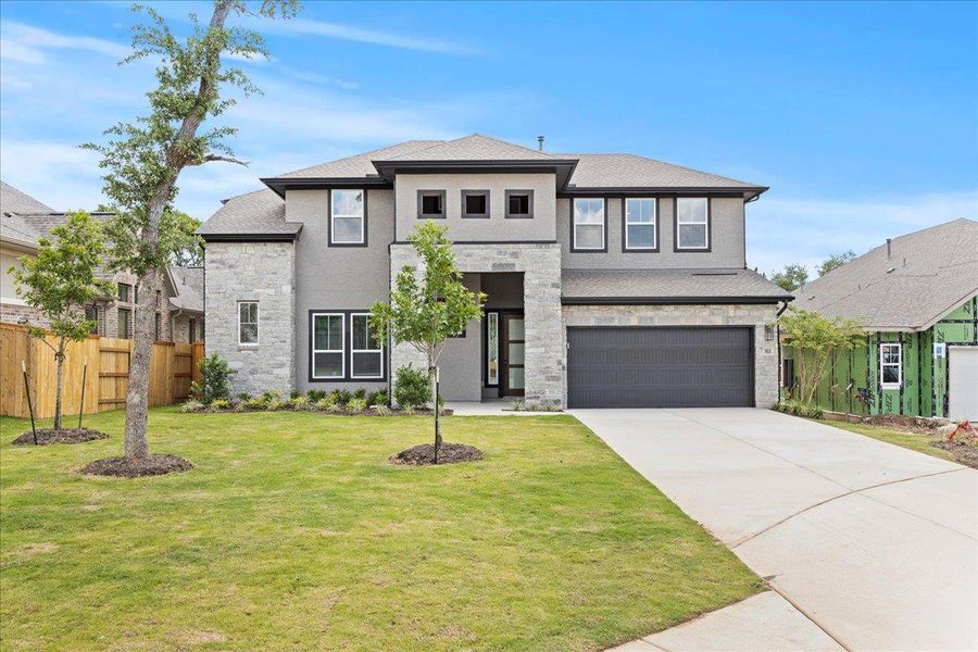 Front exterior of a new home in 6 Creeks, Kyle, TX, highlighting curb appeal (Image 21). Front exterior of a new home in 6 Creeks, Kyle, TX, highlighting curb appeal (Image 21).