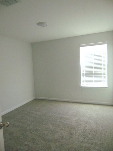 The third bedroom, which is located on the second floor