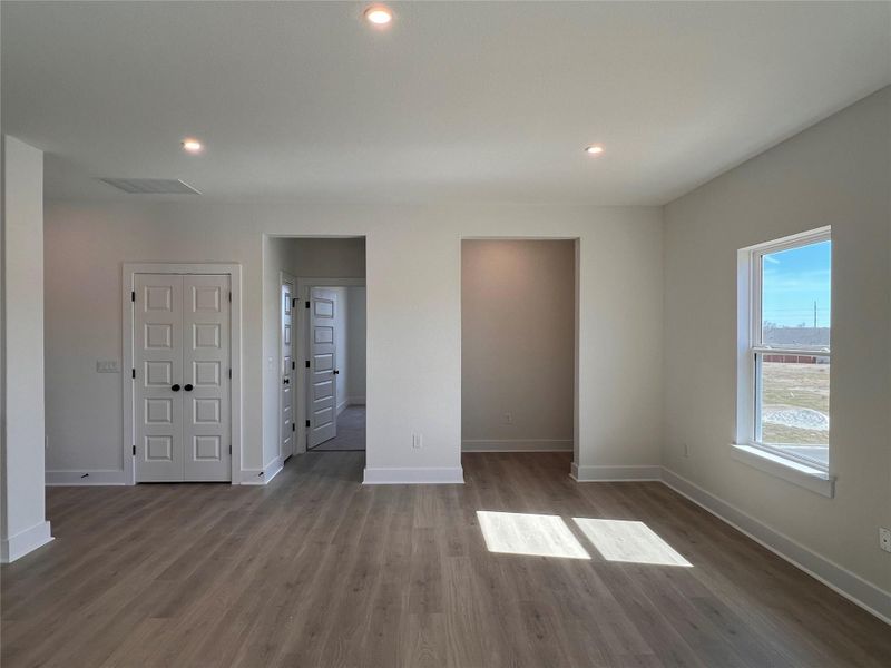 Unfurnished bedroom with dark wood finished floors and recessed lighting
