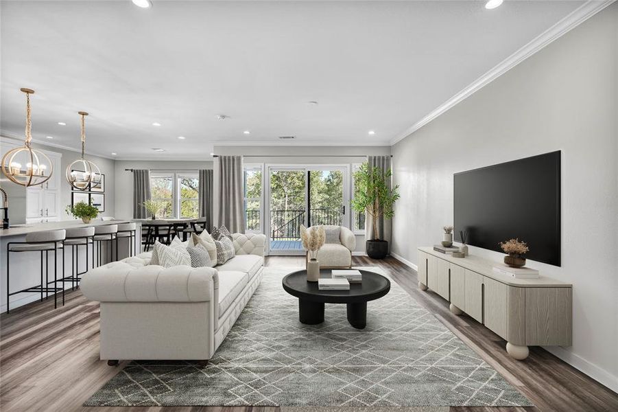 Living room featuring light wood-style flooring, recessed lighting, a chandelier, and ornamental molding