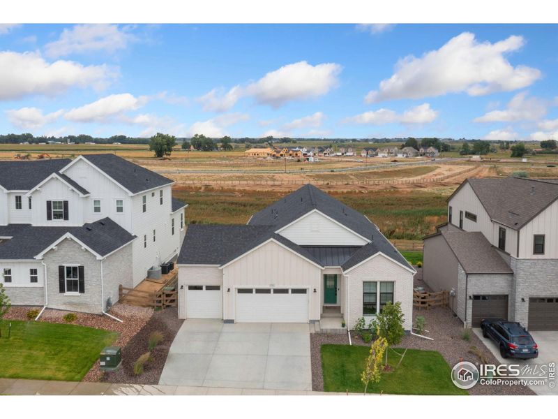 Front exterior of a new home in , Timnath, CO, highlighting curb appeal (Image 22).