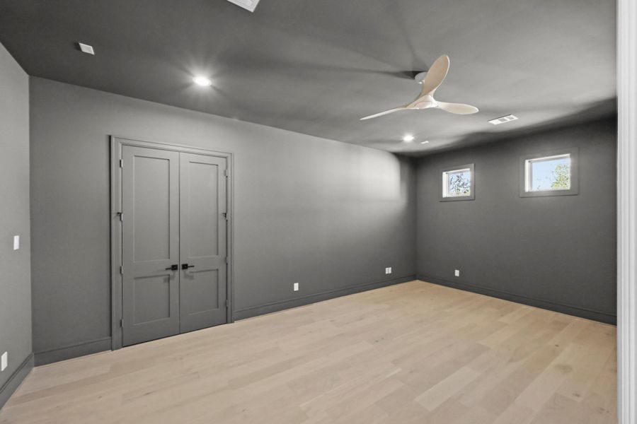 The media room could easily function as a gym or second office!