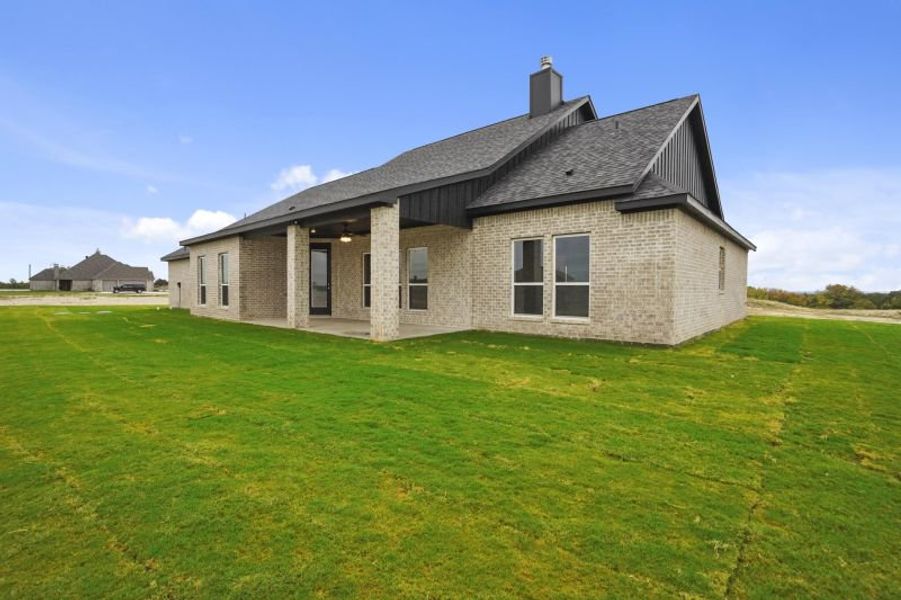 Front exterior of a new home in Rocky Top Ranch, Reno, TX, highlighting curb appeal (Image 26). Front exterior of a new home in Rocky Top Ranch, Reno, TX, highlighting curb appeal (Image 26).