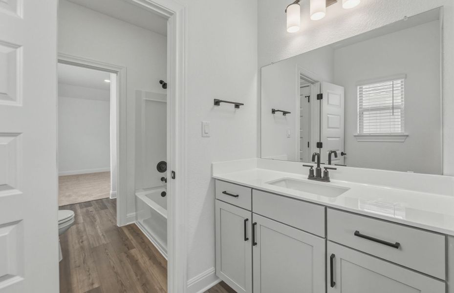 Representative furnished interior of a home built from the Woodland by Pulte Homes in Santa Rita Ranch, Liberty Hill (Image 8).