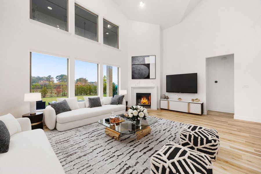 Tall ceilings and expansive windows create a bright, welcoming atmosphere throughout the main living space.