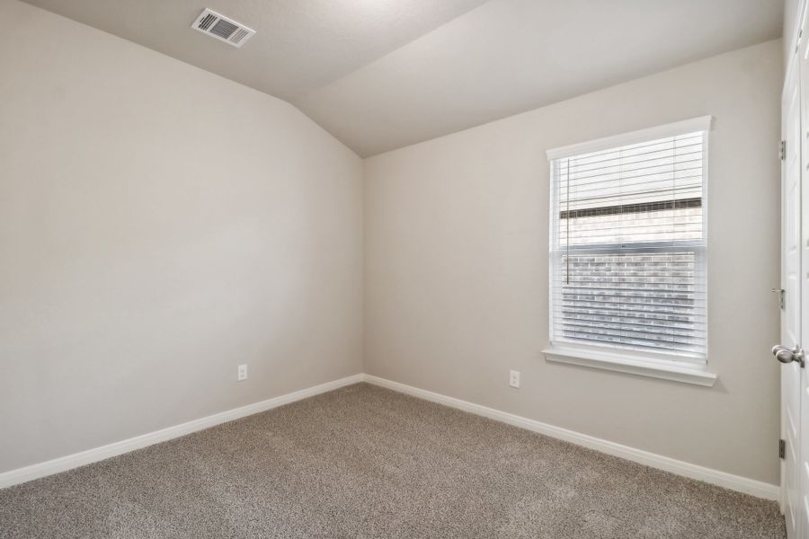 Guest bedroom in the Cascade floorplan at a Meritage Homes community.